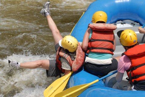 rafting person falling out of a raft